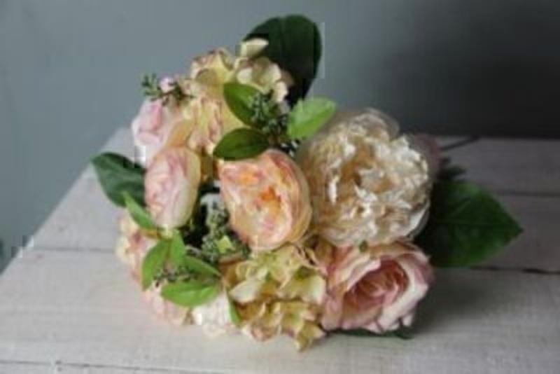 Bouquet of Peach and Cream Artificial Rose Flowers by Bloomsbury. Tied together with simple organza bow. 25 stems of Artificial Flowers and Foliage. Can also be called silk flowers the quality of these artificial flowers by Bloomsbury is second to none